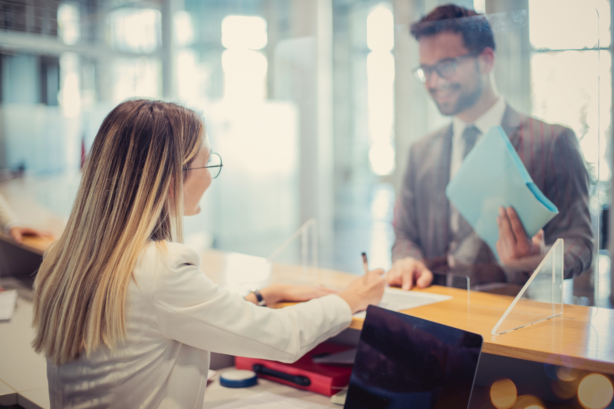 Banking and Finance Woman helping man at bank